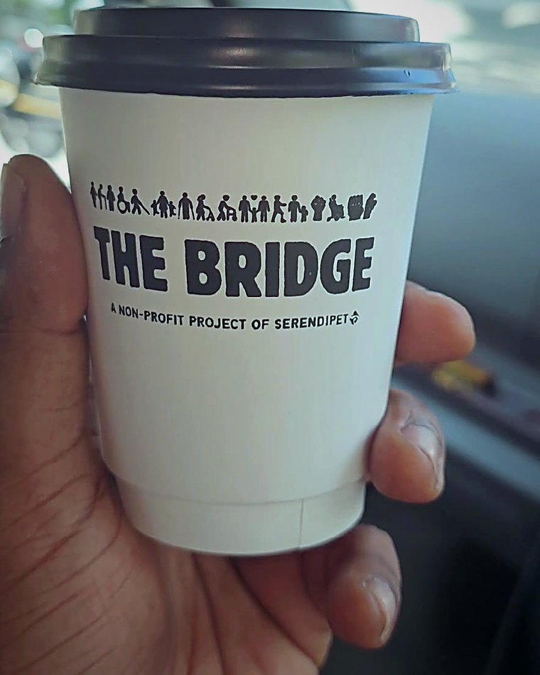 A takeaway cup from The Bridge — imagine your event's logo on it